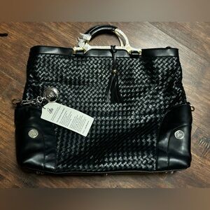 Nwt blk Joy Mangano The Designer Drop Bag in a black woven faux-leather.